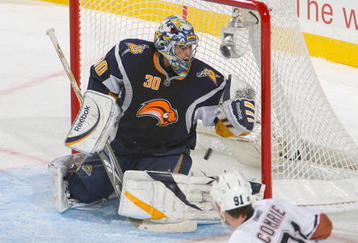 BUFFALO, NY - NOVEMBER 11:  Ryan Miller #30 of the Buffalo Sabres allows a shot by Patrick O'Sullivan #19 of the Edmonton Oilers (not shown ) to get past for Edmonton's first goal as Mike Comrie #91 of the Oilers watches  at HSBC Arena on November 11, 2009 in Buffalo, New York.  (Photo by Rick Stewart/Getty Images)