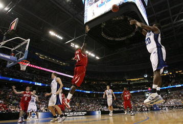 TAMPA, FL - MARCH 21:  Josh Young #20 of the Drake Bulldogs goes up for a shot over Boris Siakam #21 of the Western Kentucky Hilltoppers during the first round of the 2008 NCAA Tournament West Regional at the St. Pete Times Forum on March 21, 2008 in Tampa, Florida.  (Photo by Doug Benc/Getty Images)