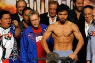 LAS VEGAS - NOVEMBER 13:  Manny Pacquiao weighs in for his upcoming bout against WBO welterweight champion Miguel Cotto at the MGM Grand Garden Arena on November 13, 2009 in Las Vegas, Nevada. Pacquiao and Cotto will meet in a WBO welterweight title fight at the MGM Grand on November 14.  Pacquiao weighed in at 144 pounds and Cotto weighed in at 145 pounds.  (Photo by Ethan Miller/Getty Images)
