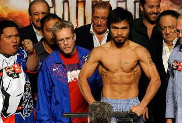 LAS VEGAS - NOVEMBER 13:  Manny Pacquiao weighs in for his upcoming bout against WBO welterweight champion Miguel Cotto at the MGM Grand Garden Arena on November 13, 2009 in Las Vegas, Nevada. Pacquiao and Cotto will meet in a WBO welterweight title fight at the MGM Grand on November 14.  Pacquiao weighed in at 144 pounds and Cotto weighed in at 145 pounds.  (Photo by Ethan Miller/Getty Images)