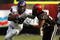 SAN DIEGO - NOVEMBER 07:  Running back Matthew Tucker #29 of the Texas Christian University Horned Frogs carries the ball as he stiffarms corner back Leon McFadden #20 of the San Diego State Aztecs on November 7, 2009 at Qualcomm Stadium in San Diego, California.   TCU won 55-12.  (Photo by Stephen Dunn/Getty Images)