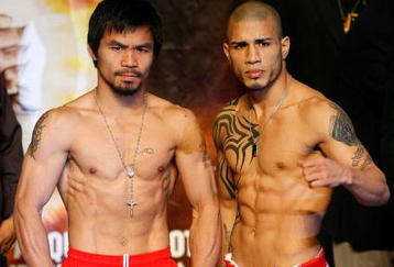 LAS VEGAS - NOVEMBER 13:  Manny Pacquiao (L) and WBO welterweight champion Miguel Cotto stand next to each other during the weigh-in for their bout at the MGM Grand Garden Arena on November 13, 2009 in Las Vegas, Nevada. Pacquiao and Cotto will meet in a WBO welterweight title fight at the MGM Grand on November 14.  Pacquiao weighed in at 144 pounds and Cotto weighed in at 145 pounds.  (Photo by Ethan Miller/Getty Images)