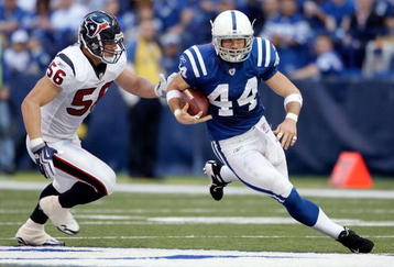 INDIANAPOLIS - NOVEMBER 08: Dallas Clark #44 of the Indianapolis Colts runs with the ball while defended by Brian Cushing #56 of the Houston Texans  during the NFL game at Lucas Oil Stadium on November 8, 2009 in Indianapolis, Indiana.The Colts won 20-17.  (Photo by Andy Lyons/Getty Images)