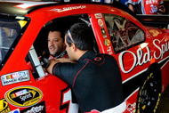 FONTANA, CA - OCTOBER 10: Tony Stewart (L), driver of the #14 Office Depot/Old Spice Chevrolet, talks with Juan Pablo Montoya (R), driver of the #42 Target Chevrolet, during practice for the NASCAR Sprint Cup Series Pepsi 500 at Auto Club Speedway on October 10, 2009 in Fontana, California. (Photo by Rusty Jarrett/Getty Images for NASCAR)