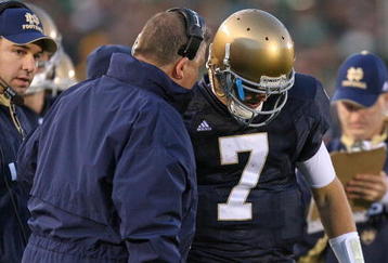 SOUTH BEND, IN - OCTOBER 17: Head coach Charlie Weis of the Notre Dame Fighting Irish gives a play to quarterback Jimmy Clausen #7 during a game against the USC Trojans at Notre Dame Stadium on October 17, 2009 in South Bend, Indiana. USC defeated Notre Dame 34-27. (Photo by Jonathan Daniel/Getty Images)