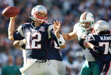 FOXBORO, MA - NOVEMBER 08:  Tom Brady #12 of the New England Patriots passes the ball in the first quarter against the Miami Dolphins on November 8, 2009 at Gillette Stadium in Foxboro, Massachusetts.  (Photo by Elsa/Getty Images)