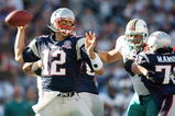 FOXBORO, MA - NOVEMBER 08:  Tom Brady #12 of the New England Patriots passes the ball in the first quarter against the Miami Dolphins on November 8, 2009 at Gillette Stadium in Foxboro, Massachusetts.  (Photo by Elsa/Getty Images)