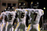 BOULDER, CO - SEPTEMBER 18:  Quarterback Pat White #5 of the West Virginia Mountaineers along with Will Johnson #6 and Noel Devine #7 line up in the back field against the Colorado Buffaloes at Folsom Field on September 18, 2008 in Boulder, Colorado. Colorado defeated West Virginia 17-14 in overtime.  (Photo by Doug Pensinger/Getty Images)