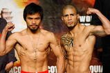 LAS VEGAS - NOVEMBER 13:  Manny Pacquiao (L) and WBO welterweight champion Miguel Cotto stand next to each other during the weigh-in for their bout at the MGM Grand Garden Arena on November 13, 2009 in Las Vegas, Nevada. Pacquiao and Cotto will meet in a WBO welterweight title fight at the MGM Grand on November 14. Pacquiao weighed in at 144 pounds and Cotto weighed in at 145 pounds.  (Photo by Ethan Miller/Getty Images)