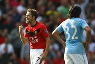 MANCHESTER, ENGLAND - SEPTEMBER 20:  Michael Owen of Manchester United celebrates scoring the winning goal in injury time during the Barclays Premier League match between Manchester United and Manchester City at Old Trafford on September 20, 2009 in Manchester, England.  (Photo by Alex Livesey/Getty Images)