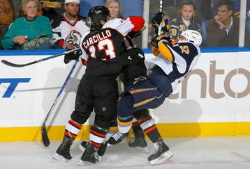 BUFFALO, NY - NOVEMBER 06: Dan Carcillo #13 of the Philadelphia Flyers checks Craig Rivet #52 of the Buffalo Sabres at HSBC Arena on November 6, 2009 in Buffalo, New York.  (Photo by Rick Stewart/Getty Images)