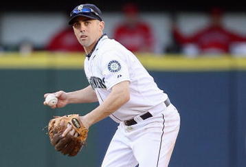 SEATTLE - SEPTEMBER 02:  Jack Wilson #9 of the Seattle Mariners throws to firstbase against the Los Angeles Angels of Anaheim at Safeco Field on September 2, 2009 in Seattle, Washington. (Photo by Otto Greule Jr/Getty Images)