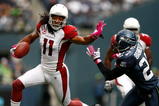SEATTLE , WA - OCTOBER 18:  Larry Fitzgerald #11 of the Arizona Cardinals runs the ball against the Seattle Seahawks at Qwest Field on October 18, 2009 in Seattle, Washington.  (Photo by Jonathan Ferrey/Getty Images)