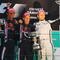 SHANGHAI, CHINA - APRIL 19: Race winner Sebastian Vettel (C) of Germany and Red Bull Racing celebrates with second placed team mate Mark Webber (L) of Australia and Red Bull Racing and third placed Jenson Button (R) of Great Britain and Brawn GP on the podium after the Chinese Formula One Grand Prix at the Shanghai International Circuit on April 19, 2009 in Shanghai, China. (Photo by Mark Thompson/Getty Images)