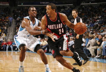NEW ORLEANS - NOVEMBER 13:  Andre Miller #24 of the Portland Trail Blazers drives the ball against Chris Paul #3 of the New Orleans Hornets during the game at New Orleans Arena on November 13, 2009 in New Orleans, Louisiana.  NOTE TO USER: User expressly acknowledges and agrees that, by downloading and or using this photograph, User is consenting to the terms and conditions of the Getty Images License Agreement. (Photo by Chris Graythen/Getty Images)