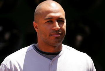OAKLAND, CA - MAY 09:  Vernon Wells #10 of the Toronto Blue Jays walks in the dugout before their game against the Oakland Athletics on May 9, 2009 at the Oakland Coliseum in Oakland, California.  (Photo by Ezra Shaw/Getty Images)