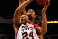 TAMPA, FL - MARCH 12:  Kodi Augustus #24 of the Mississippi State Bulldogs makes a shot around Brandon Bolen #33 of the Georgia Bulldogs during the first round of the SEC Men's Basketball Tournament on March 12, 2009 at The St. Pete Times Forum in Tampa, Florida.  (Photo by Chris Graythen/Getty Images)