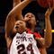 TAMPA, FL - MARCH 12: Kodi Augustus #24 of the Mississippi State Bulldogs makes a shot around Brandon Bolen #33 of the Georgia Bulldogs during the first round of the SEC Men's Basketball Tournament on March 12, 2009 at The St. Pete Times Forum in Tampa, Florida. (Photo by Chris Graythen/Getty Images)
