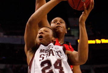 TAMPA, FL - MARCH 12:  Kodi Augustus #24 of the Mississippi State Bulldogs makes a shot around Brandon Bolen #33 of the Georgia Bulldogs during the first round of the SEC Men's Basketball Tournament on March 12, 2009 at The St. Pete Times Forum in Tampa, Florida.  (Photo by Chris Graythen/Getty Images)