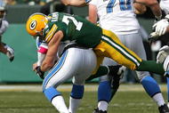 GREEN BAY, WI - OCTOBER 18: Aaron Kampman #74 of the Green Bay Packers sacks Duante Culpepper #11 of the Detroit Lions at Lambeau Field on October 18, 2009 in Green Bay, Wisconsin. The Packers defeated the Lions 26-0. (Photo by Jonathan Daniel/Getty Images)