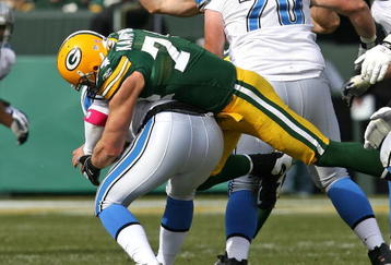 GREEN BAY, WI - OCTOBER 18: Aaron Kampman #74 of the Green Bay Packers sacks Duante Culpepper #11 of the Detroit Lions at Lambeau Field on October 18, 2009 in Green Bay, Wisconsin. The Packers defeated the Lions 26-0. (Photo by Jonathan Daniel/Getty Images)
