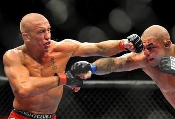 LAS VEGAS - JULY 11:  (L-R) Georges St. Pierre battles Thiago Alves during their welterweight title bout during UFC 100 on July 11, 2009 in Las Vegas, Nevada.  (Photo by Jon Kopaloff/Getty Images)