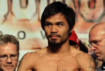LAS VEGAS - NOVEMBER 13:  Manny Pacquiao weighs in for his upcoming bout against WBO welterweight champion Miguel Cotto at the MGM Grand Garden Arena on November 13, 2009 in Las Vegas, Nevada. Pacquiao and Cotto will meet in a WBO welterweight title fight at the MGM Grand on November 14.  Pacquiao weighed in at 144 pounds and Cotto weighed in at 145 pounds.  (Photo by Al Bello/Getty Images)