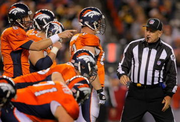 DENVER - NOVEMBER 09:  Quarterback Kyle Orton #8 of the Denver Broncos directs the offense against the Pittsburgh Steelers as umpire Garth DeFelice looks on during NFL action at Invesco Field at Mile High on November 9, 2009 in Denver, Colorado. The Steelers defeated the Broncos 28-10.  (Photo by Doug Pensinger/Getty Images)