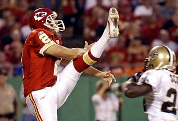 KANSAS CITY, MO - AUGUST 31:   Punter Dustin Colquitt #2 of the Kansas City Chiefs punts under pressure in a preseason game against the New Orleans Saints at Arrowhead Stadium August 31, 2006 in Kansas City, Missouri. The Chiefs defeated the Saints 10 to 9.  (Photo by Tim Umphrey/Getty Images)