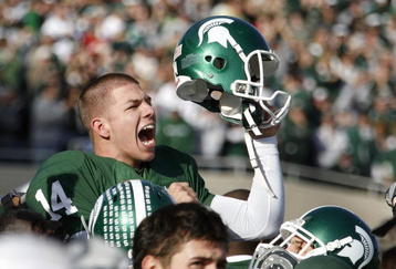 EAST LANSING, MI - NOVEMBER 01:  Brett Swenson #14 of the Michigan State Spartans reacts on his teammates shoulders after kicking game winning field goal to beat the Wisconsin Badgers 25-24 on November 1, 2008 at Spartan Stadium in East Lansing, Michigan.  (Photo by Gregory Shamus/Getty Images)