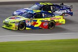 JOLIET, IL - JULY 11: Mark Martin, driver of the #5 CARQUEST/Kellogg's Chevrolet, races Jimmie Johnson, driver of the #48 Lowe's Chevrolet, during the NASCAR Sprint Cup Series LifeLock.com 400 at Chicagoland Speedway on July 11, 2009 in Joliet, Illinois.  (Photo by Geoff Burke/Getty Images for NASCAR)