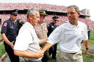 COLUMBUS, OH - SEPTEMBER 24: Head coach Jim Tressel of Ohio State receives a hand shake from head coach Kirk Ferentz of Iowa after the fourth quarter on September 24, 2005 at Ohio Stadium in Columbus, Ohio. Ohio State defeated Iowa 31-6. (Photo by Harry How/Getty Images)