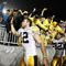 STATE COLLEGE, PA - SEPTEMBER 26:  Ricky Stanzi #12 of the Iowa Hawkeyes along with Adam Robinson #32 and Brett Morse #36 celebrate a 21-10 victory over the Penn State Nittnay Lions with Iowa fans on September 26, 2009 at Beaver Stadium in State College, Pennsylvania.  (Photo by Gregory Shamus/Getty Images)