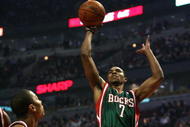 CHICAGO - MARCH 06:  Ramon Sessions #7 of the Milwaukee Bucks attempts a shot in the first quarter against Derrick Rose #1 of the Chicago Bulls at the United Center on March 6, 2009 in Chicago, Illinois.  NOTE TO USER: User expressly acknowledges and agreees that, by downloading and/or using this Photograph, User is consenting to the terms and conditions of the Getty Images License Agreement.  (Photo by Jonathan Daniel/Getty Images)