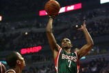CHICAGO - MARCH 06:  Ramon Sessions #7 of the Milwaukee Bucks attempts a shot in the first quarter against Derrick Rose #1 of the Chicago Bulls at the United Center on March 6, 2009 in Chicago, Illinois.  NOTE TO USER: User expressly acknowledges and agreees that, by downloading and/or using this Photograph, User is consenting to the terms and conditions of the Getty Images License Agreement.  (Photo by Jonathan Daniel/Getty Images)