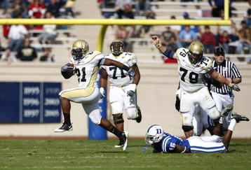 DURHAM, NC - NOVEMBER 14:  Jonathan Dwyer #21 of the Georgia Tech Yellow Jackets breaks a tackle while running with the football against the Duke Blue Devils during first half action at Wallace Wade Stadium on November 14, 2009 in Durham, North Carolina. (Photo by Joe Robbins/Getty Images)