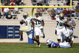 DURHAM, NC - NOVEMBER 14:  Jonathan Dwyer #21 of the Georgia Tech Yellow Jackets breaks a tackle while running with the football against the Duke Blue Devils during first half action at Wallace Wade Stadium on November 14, 2009 in Durham, North Carolina. (Photo by Joe Robbins/Getty Images)