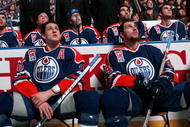 EDMONTON, CANADA - FEBRUARY 27:  Shawn Horcoff #10 and Fernando Pisani #34 of the Edmonton Oilers watch from the ice with teammates behind them on the Oilers bench as a video plays on the jumbotron during a ceremony to raise former Oilers great Mark Messier's #11 banner to the rafters of Rexall Place prior to the Oilers game against the Phoenix Coyotes on February 27, 2007 at Rexall Place in Edmonton, Alberta, Canada.  (Photo by Tim Smith/Getty Images)   