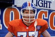 DENVER - SEPTEMBER 4:  Linebacker Karl Mecklenburg #77 of the Denver Broncos stands on the sidelines during a game against the San Diego Chargers at Mile High Stadium on September 4, 1994 in Denver, Colorado.  The Broncos won 37-34.  (Photo by George Rose/Getty Images)