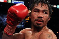 LAS VEGAS - NOVEMBER 14:  Manny Pacquiao celebrates his 12 round TKO victory against Miguel Cotto during their WBO welterweight title fight at the MGM Grand Garden Arena on November 14, 2009 in Las Vegas, Nevada.  (Photo by Al Bello/Getty Images)