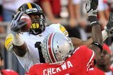 COLUMBUS, OH - NOVEMBER 14:  Wide receiver Derrell Johnson-Koulianos #15 of the Iowa Hawkeyes tries to haul in a pass as he is defended by Chimdi Chekwa #5 of the Ohio State Buckeyes at Ohio Stadium on November 14, 2009 in Columbus, Ohio. Chekwa was called for pass interference on the play.  (Photo by Jamie Sabau/Getty Images)