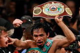 LAS VEGAS - NOVEMBER 14:  Manny Pacquiao celebrates his 12 round TKO victory against Miguel Cotto during their WBO welterweight title fight at the MGM Grand Garden Arena on November 14, 2009 in Las Vegas, Nevada.  (Photo by Ethan Miller/Getty Images)