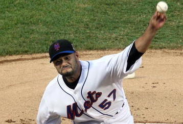 NEW YORK - AUGUST 20:  Johan Santana #57 of the New York Mets delivers a pitch against the Atlanta Braves on August 20, 2009 at Citi Field in the Flushing neighborhood of the Queens borough of New York City.  (Photo by Jim McIsaac/Getty Images)