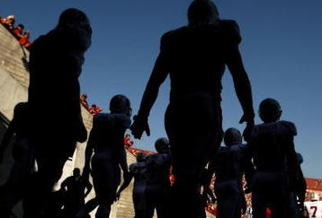 LOS ANGELES, CA - NOVEMBER 14:  The Stanford Cardinal walks out of the tunnel to take the field for the game with the USC Trojans on November 14, 2009 at the Los Angeles Coliseum in Los Angeles, California.  Stanford won 55-21.  (Photo by Stephen Dunn/Getty Images)