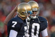 SOUTH BEND, IN - OCTOBER 17: Jimmy Clausen #7 of the Notre Dame Fighting Irish is consoled by teammate Dayne Crist #10 during a game against the USC Trojans at Notre Dame Stadium on October 17, 2009 in South Bend, Indiana. USC defeated Notre Dame 34-27. (Photo by Jonathan Daniel/Getty Images)