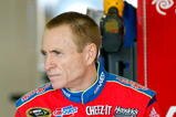 FORT WORTH, TX - NOVEMBER 07:  Mark Martin, driver of the #5 CARQUEST/Kellogg's Chevrolet, sits in the garage during practice for the NASCAR Sprint Cup Series Dickies 500 at Texas Motor Speedway on November 7, 2009 in Fort Worth, Texas.  (Photo by Geoff Burke/Getty Images for NASCAR)