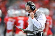 COLUMBUS, OH - NOVEMBER 14:  Head coach Jim Tressel of the Ohio State Buckeyes checks his notes as the Buckeyes play the Iowa Hawkeyes at Ohio Stadium on November 14, 2009 in Columbus, Ohio.  (Photo by Jamie Sabau/Getty Images)