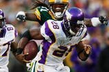 GREEN BAY, WI - NOVEMBER 01:  Al Harris #31 of the Green Bay Packers tackles Adrian Peterson #28 of the Minnesota Vikings during the third quarter of the game at Lambeau Field on November 1, 2009 in Green Bay, Wisconsin. (Photo by Scott Boehm/Getty Images)