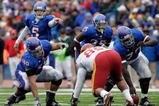 LAWRENCE, KS - OCTOBER 10: Quarterback Todd Reesing #5 and center Sal Capra #59 of the Kansas Jayhawks point out the defense during the game against the Iowa State Cyclones on October 10, 2009 at Memorial Stadium in Lawrence, Kansas. (Photo by Jamie Squire/Getty Images)