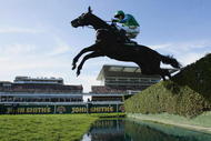 LIVERPOOL, ENGLAND - APRIL 04:  Black Apalachi ridden by Denis O'Regan jumps the water jump during the John Smith's Grand National Steeple Chase Handicap at Aintree on April 4, 2009 in Liverpool, England.  (Photo by Warren Little/Getty Images)